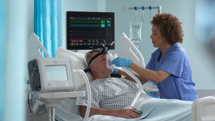 Patient hospitalis&eacute; dans son lit